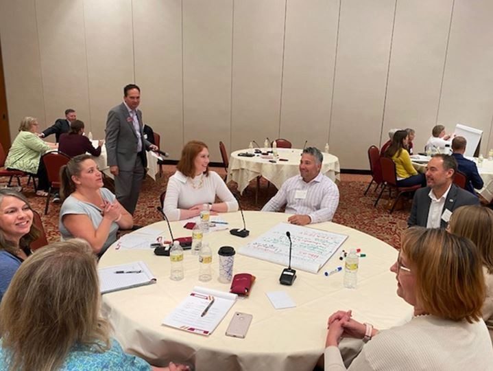 Summit facilitator Ross Mecham (Virginia Tech) listens to a small group discuss the impacts to their companies and organizations of the current lack of childcare in the NRV