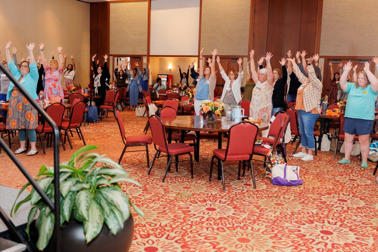 Educators participate in one of the energizers that was led by Wolf Trap